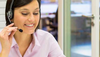 professional in office using headset to make phone call